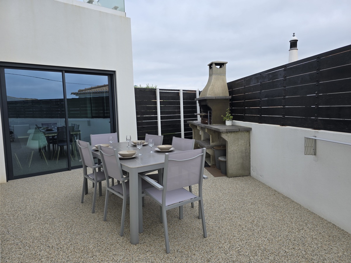 Outdoor dining area with BBQ