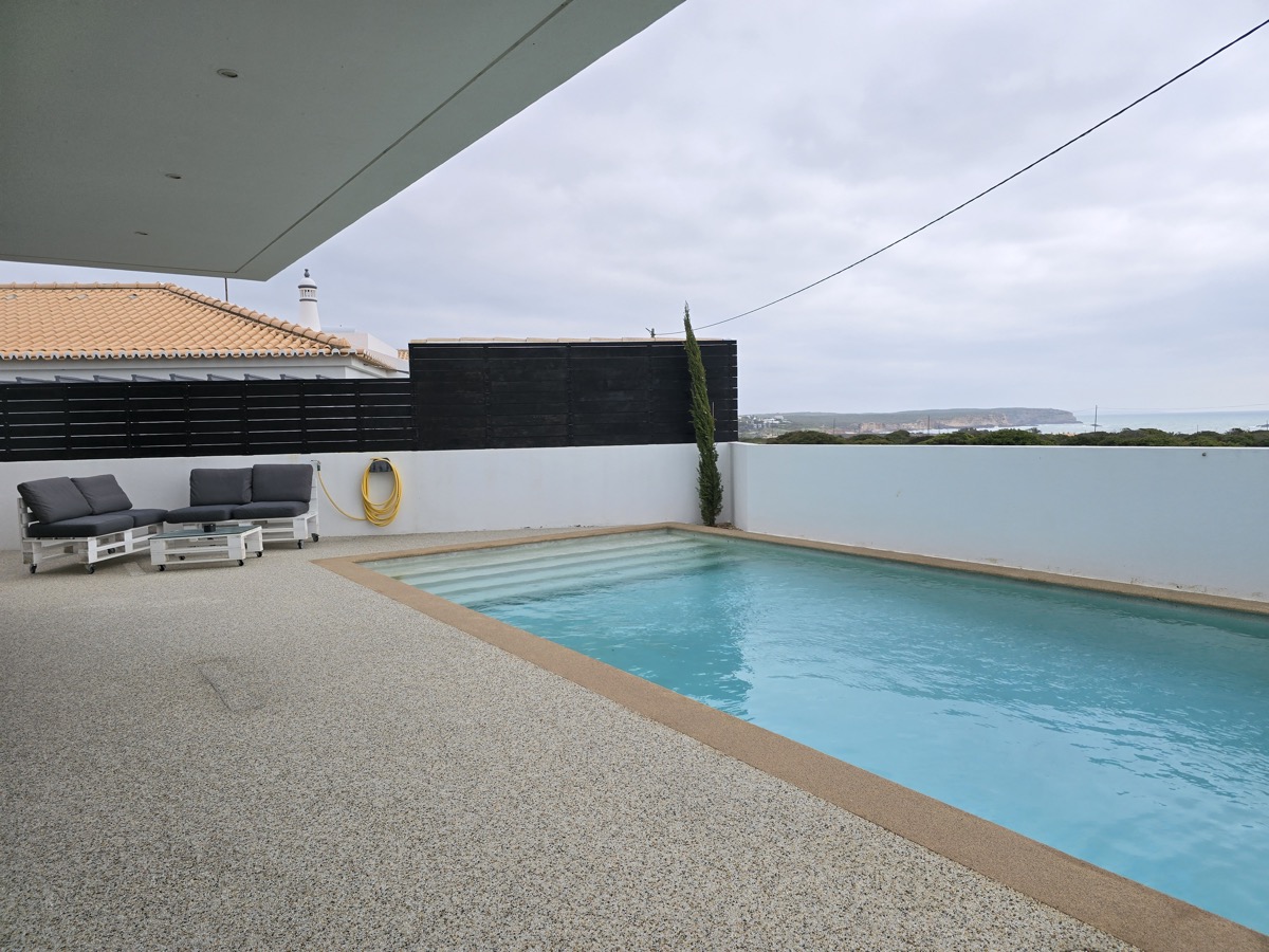 Pool sunbeds with sea view