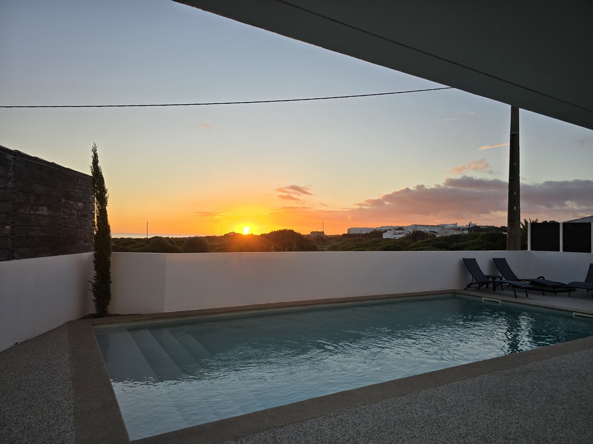 Villa pool at sunrise with sea view