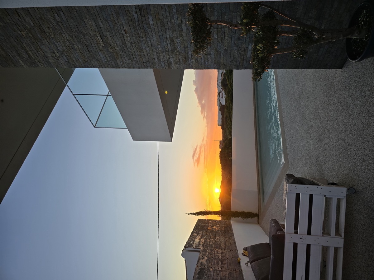 Rooftop terrace at sunset with sea view