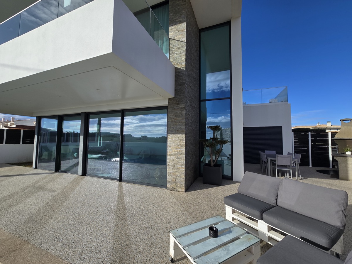 Terrace outdoor lounge with glass facade